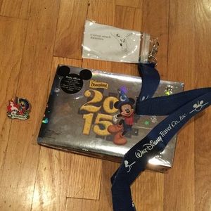Disney pin, lanyard, and 2015 photo album.